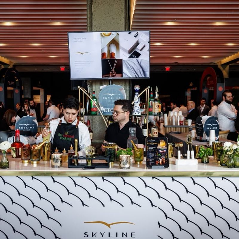 Bartenders working the branded Skyline Hotels cocktail bar