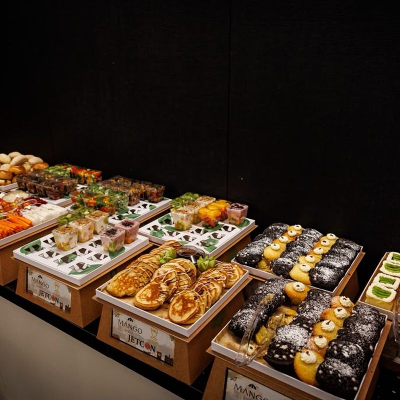 A laid-out kosher breakfast spread in branded Jetcon trays