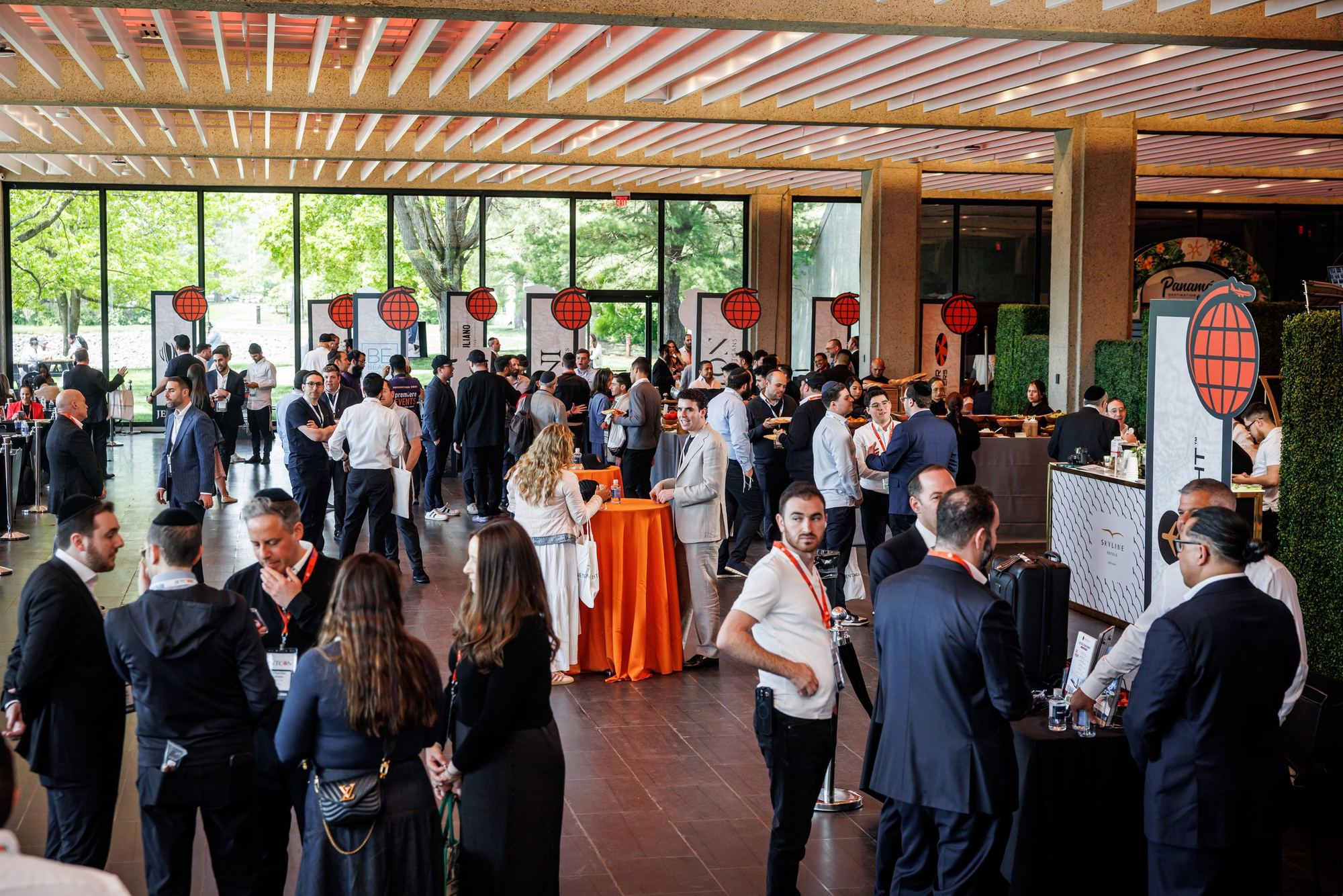 A busy Jetcon floor of branded stands and advisors in conversation