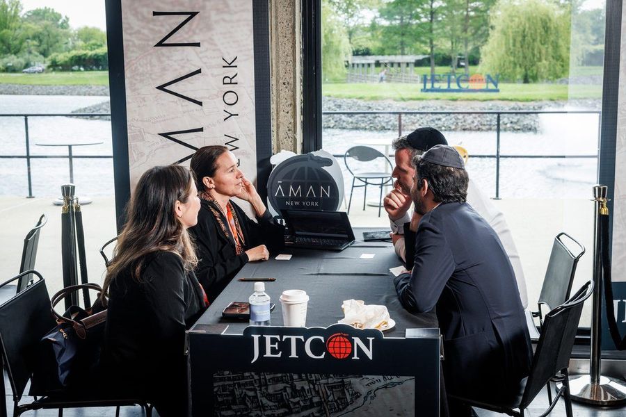 Advisors meeting at the Aman New York table, wrapped and branded by Jetcon